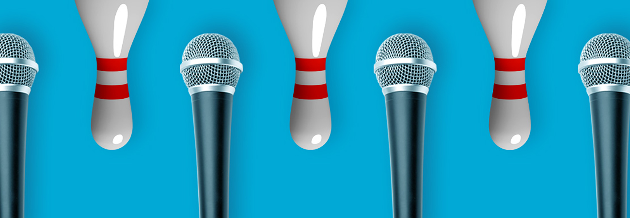 Microphones and upside-down bowling pins on a blue background