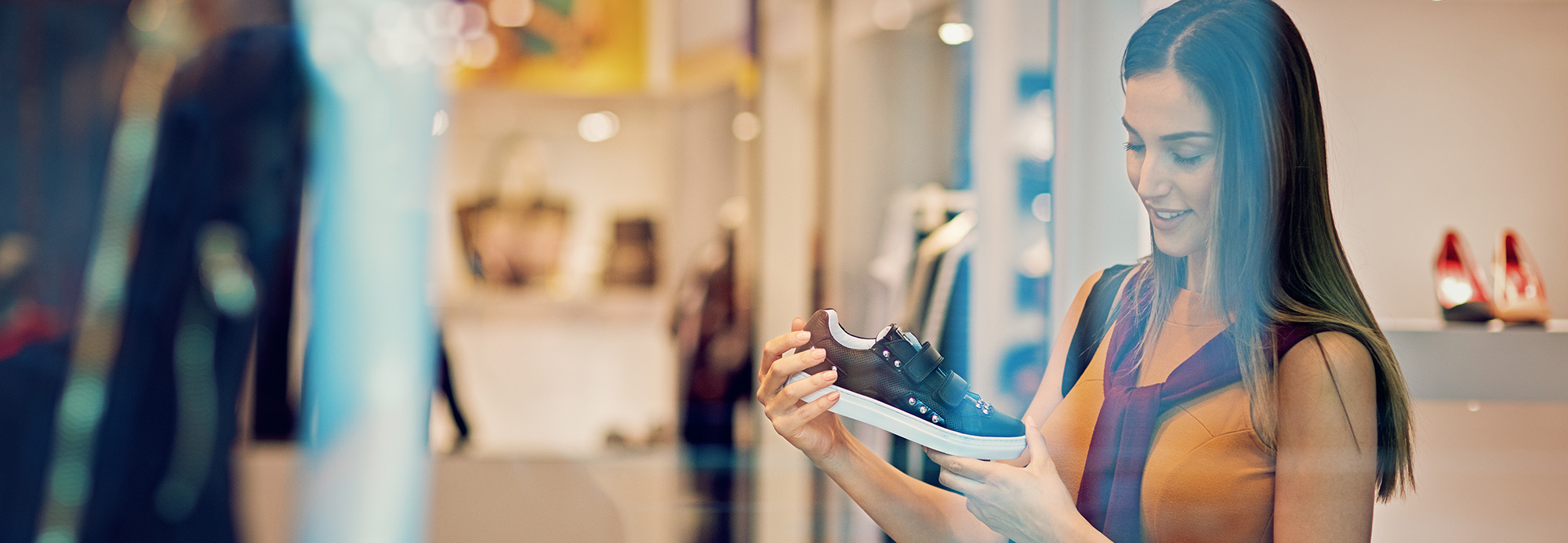 A woman shopping for shoes in a store