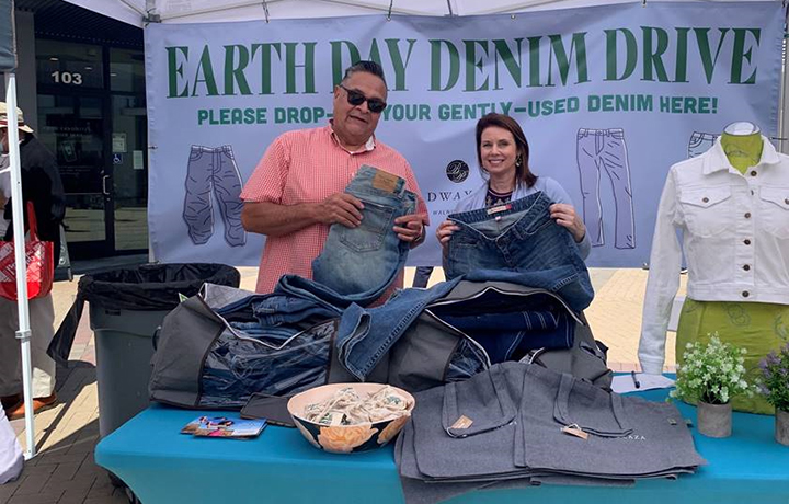 Two Macerich volunteers collecting donations at an Earth Day Denim Drive event at Broadway Plaza in Walnut Creek, CA