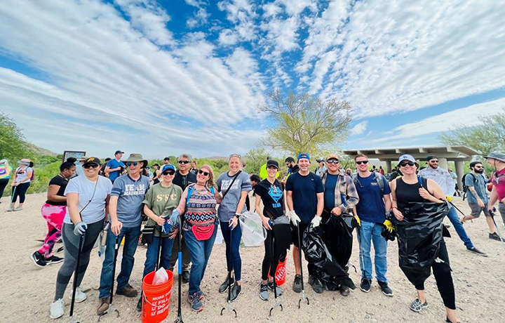 Macerich volunteers working together at a park clean-up event