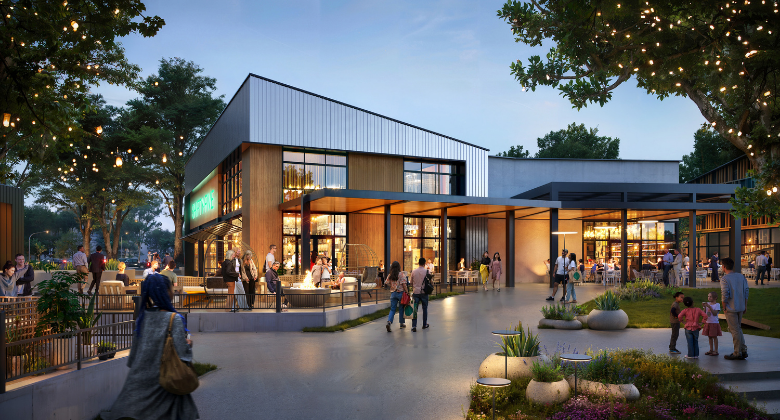 People walking into a modern shopping center with fire pit