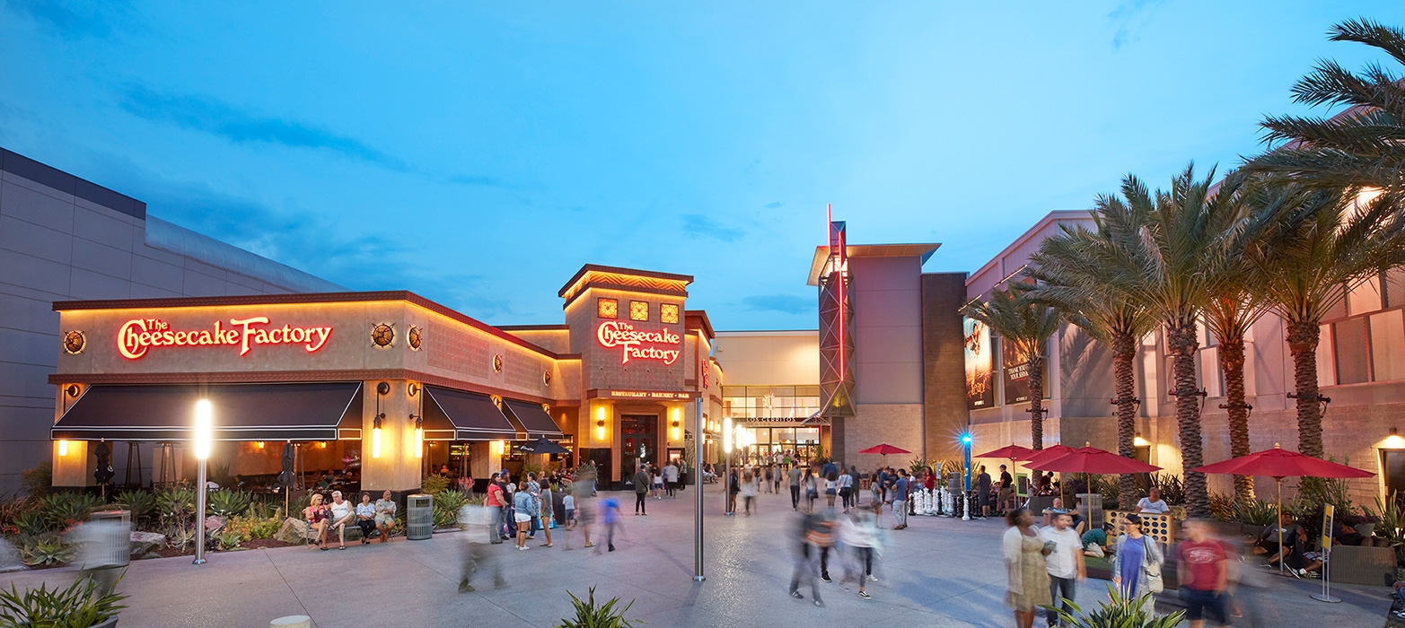 The Cheesecake Factory entrance at Los Cerritos Center in the evening