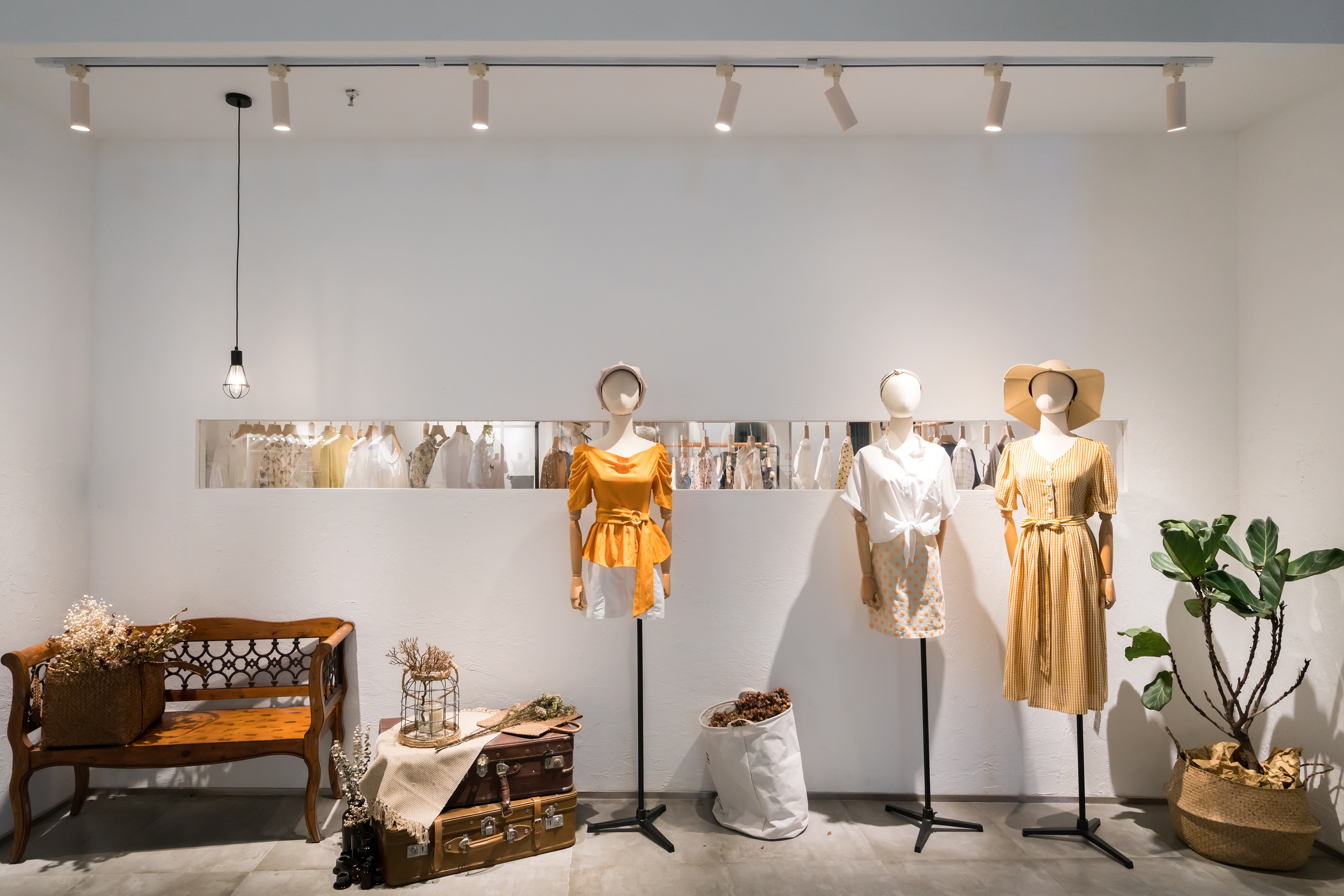 Mannequins in yellow summer apparel and décor 