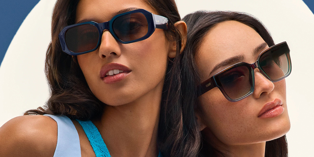 two girls wearing glasses