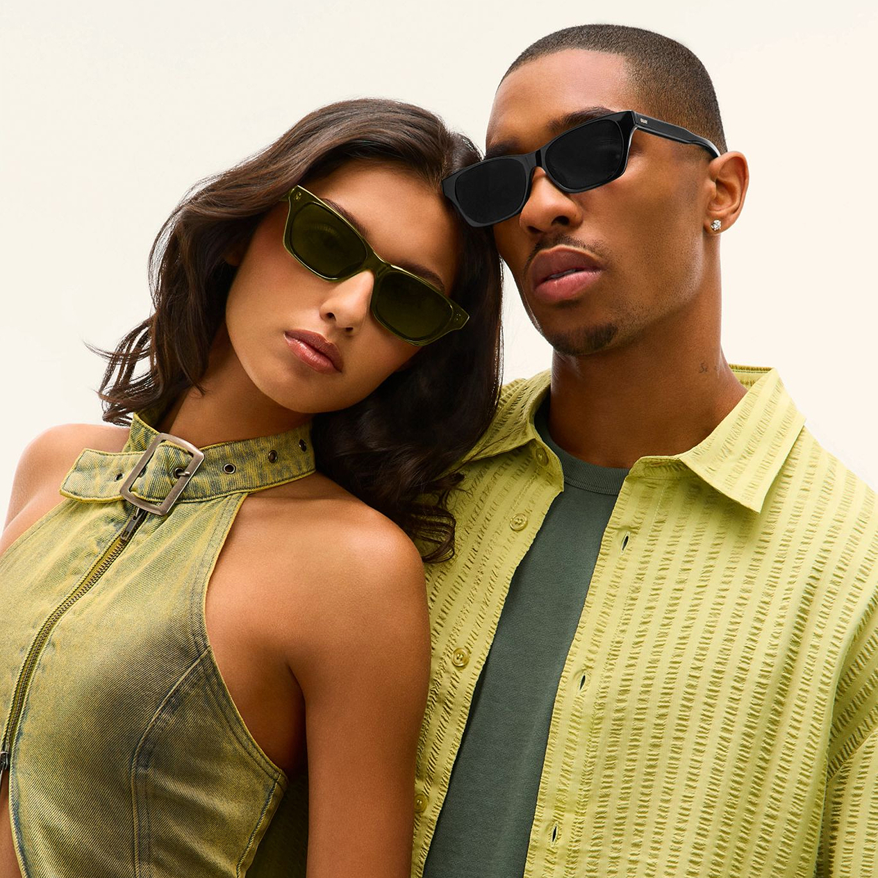 male and female model posing in sunglasses 