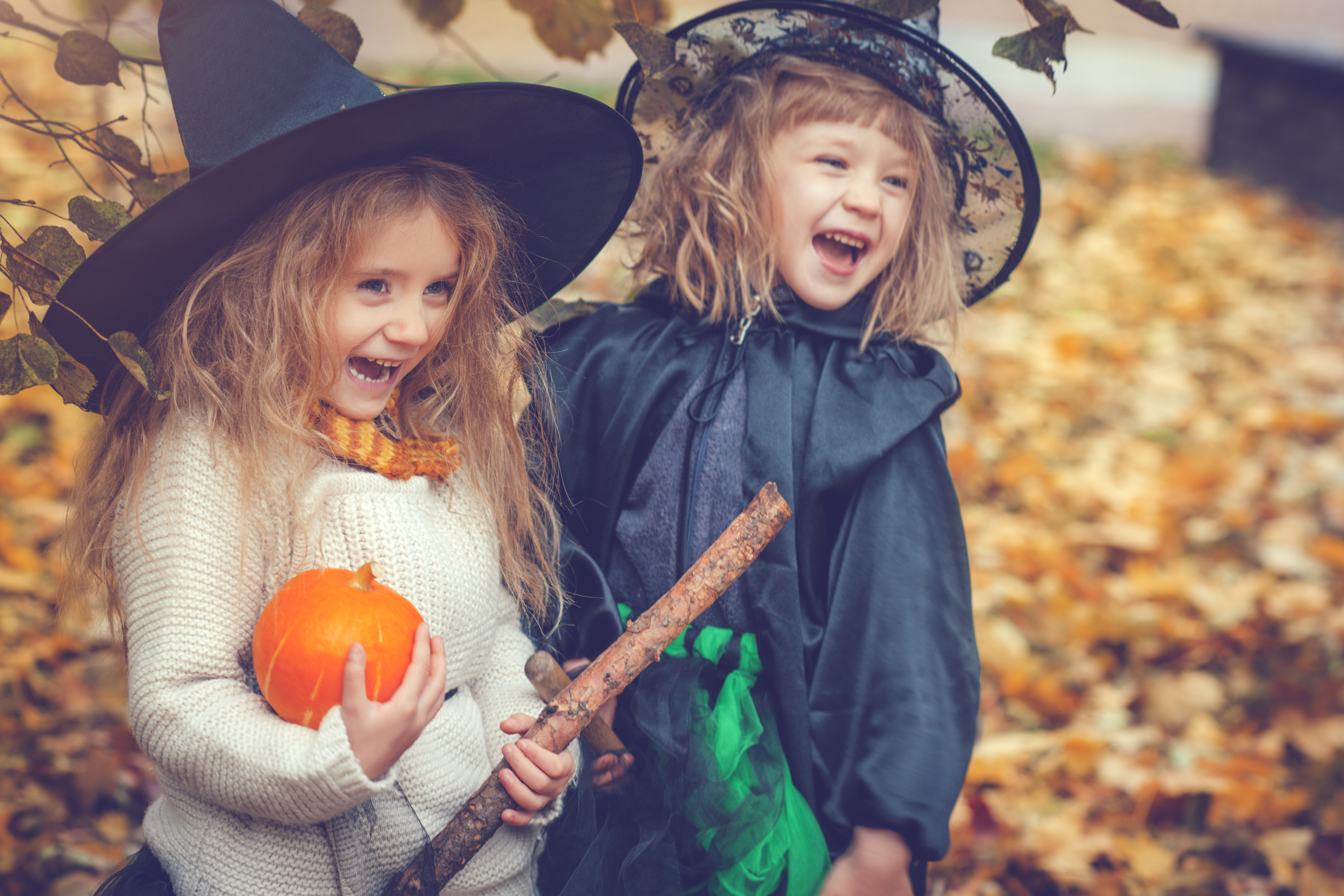 children dressed in witch costume
