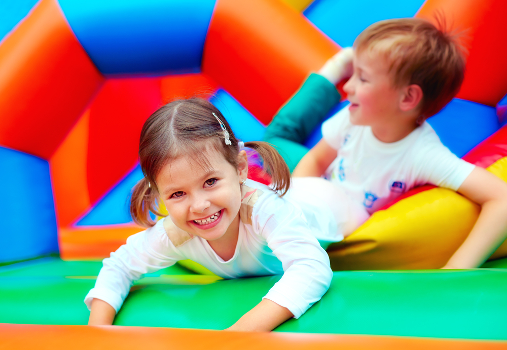 kids playing in bouncy house