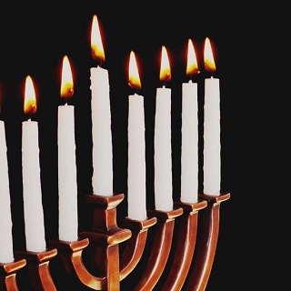 Menorah with eight candles lit.