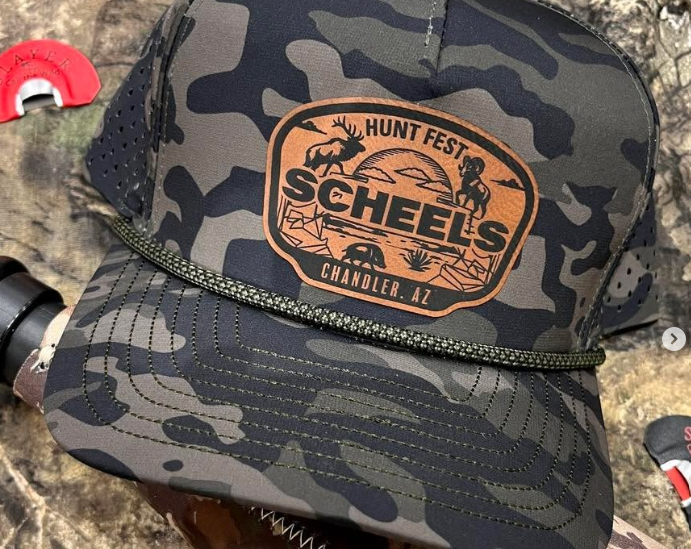 Camo baseball hat that has a logo that says Hunt Fest Scheels Chandler,AZ