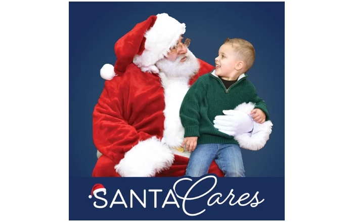 Santa will a little boy sitting on his lap. Image says "Santa Cares"