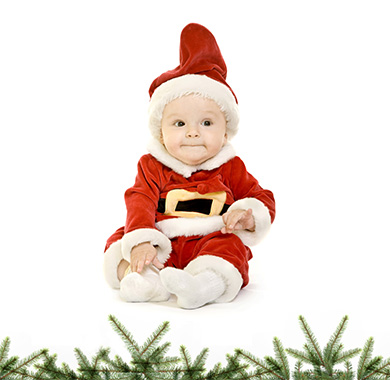 Little baby dressed in Santa costume. 