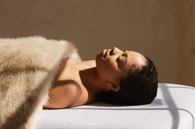 Lady laying on a massage table 