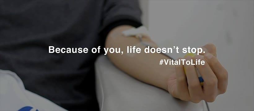 Picture of person donating blood with wording "Because of you, like doesn't stop. #VitalToLife 