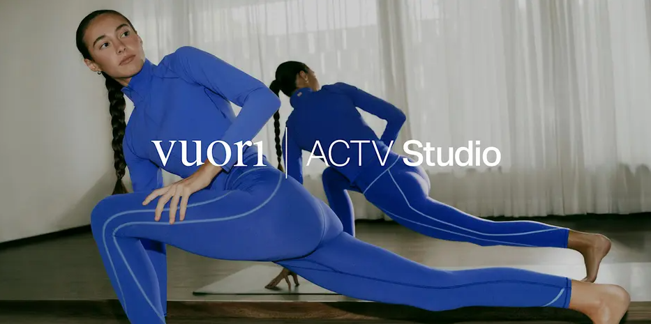 woman in athleticwear stretching on a yoga mat 