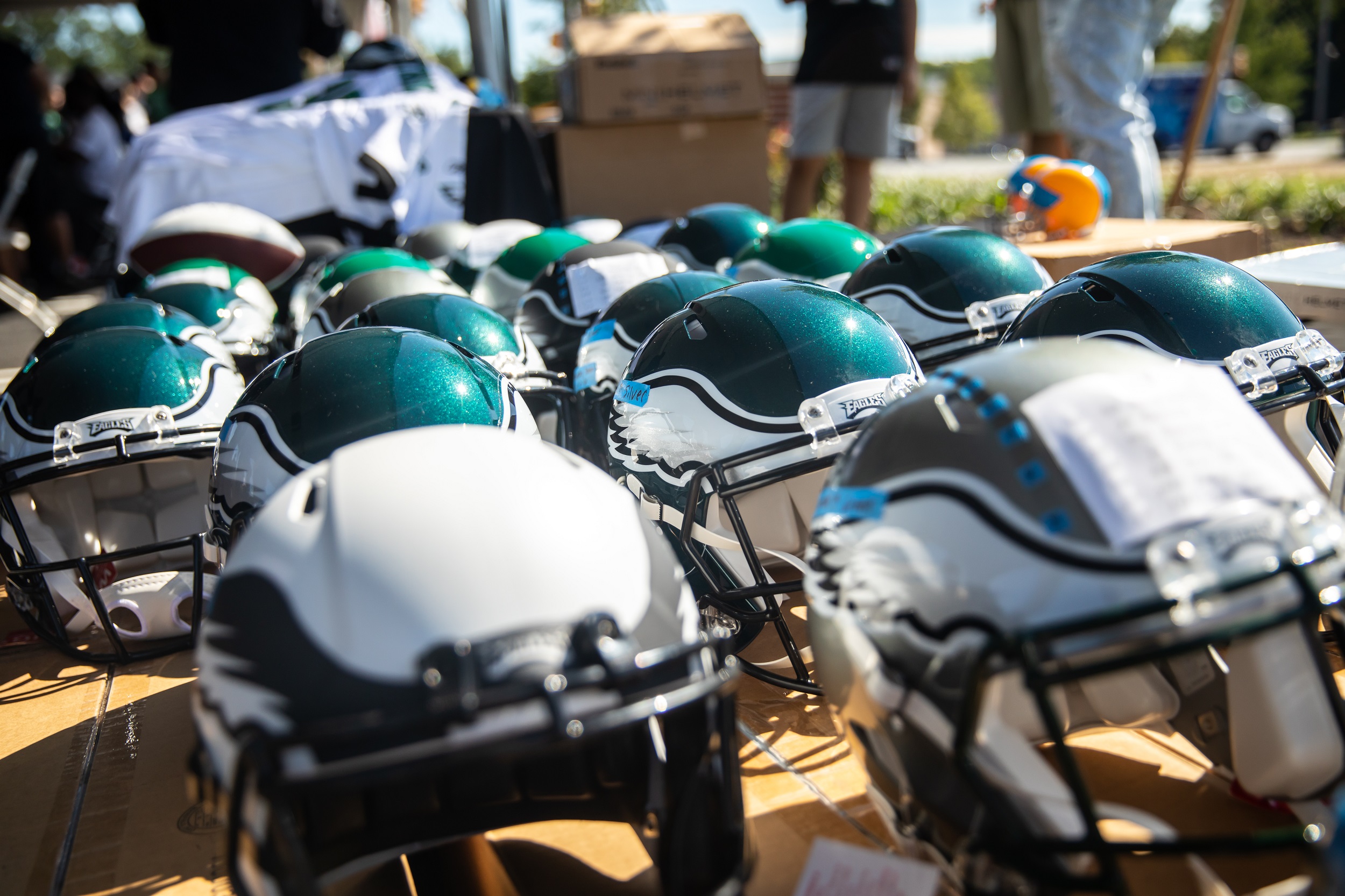 Eagles helmet lined up on table