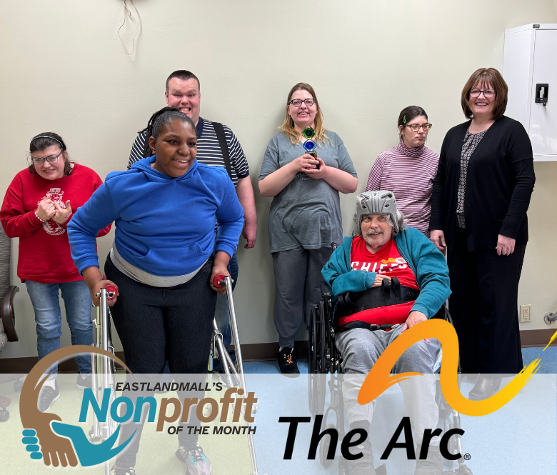 ARC of Evansville Self Advocates pose with the Nonprofit of the Month Award with Cinda Phillips, Chief Development Officer for The Arc of Evansville. 