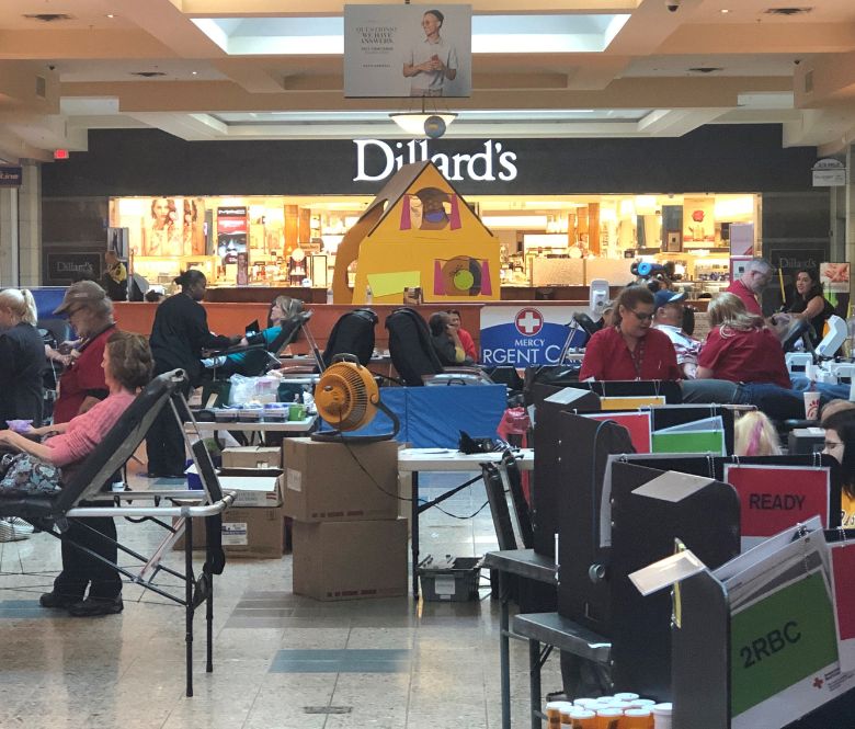 Previous blood drive at Eastland Mall with customers donating. 