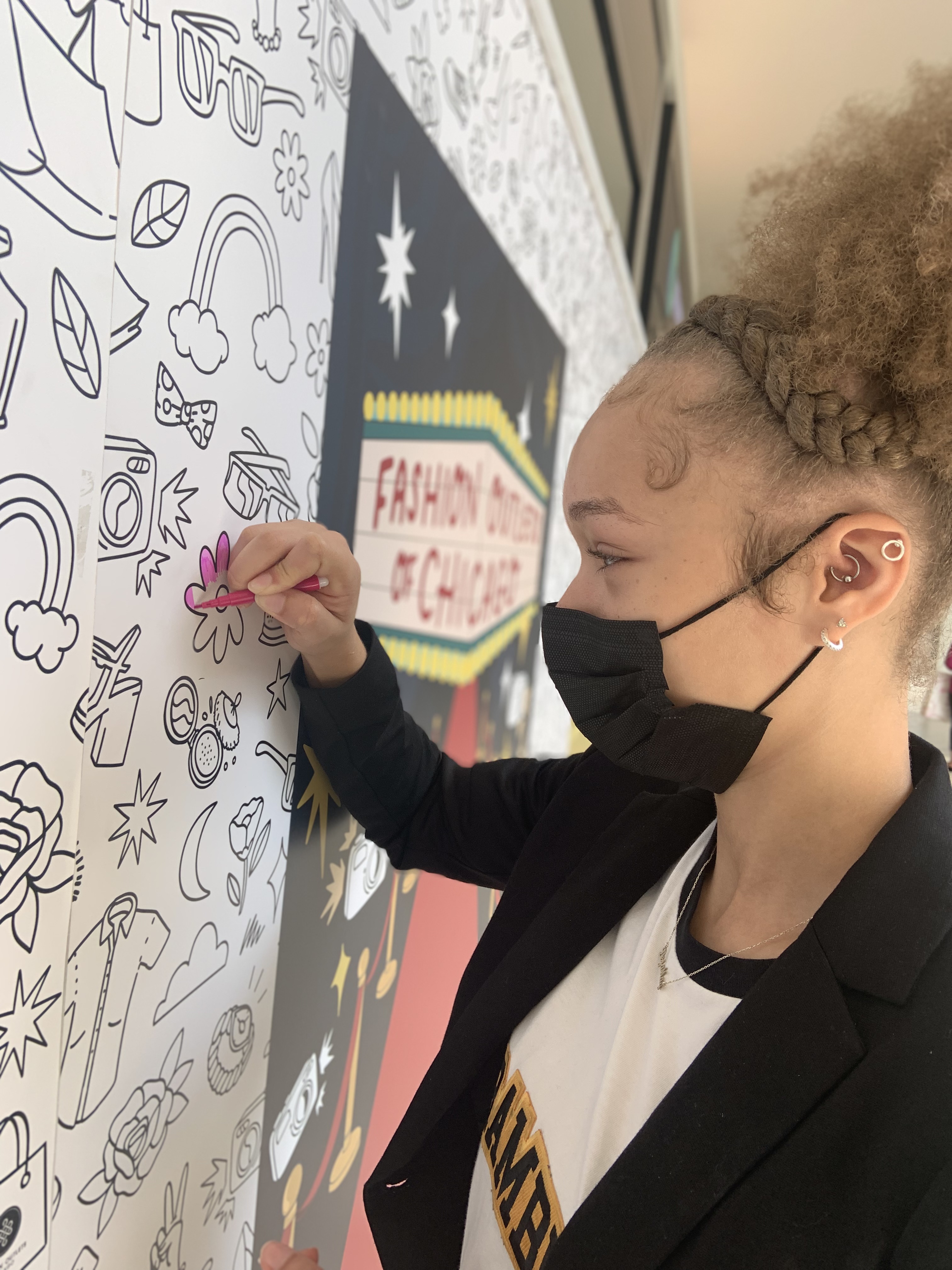 Closeup picture of a person coloring the Coloring Wall