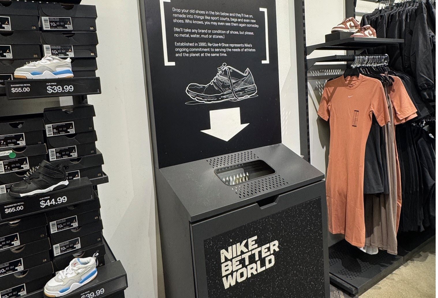 A picture of Nike's black drop off bin for recycling shoes.