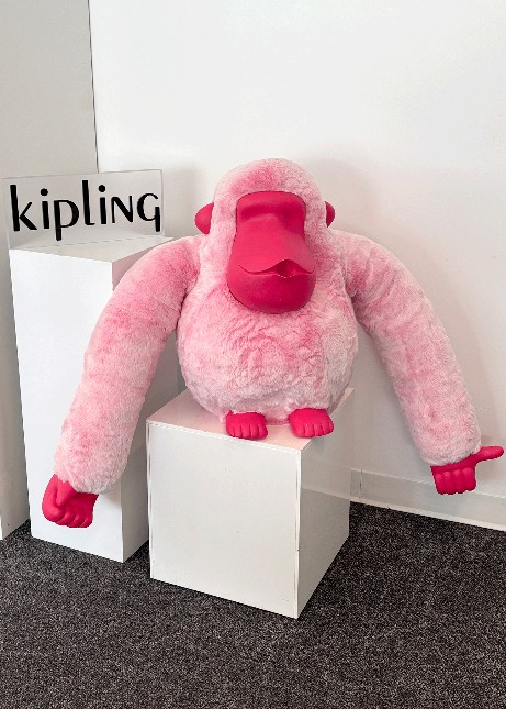 A pink Sven on a podium on display. 