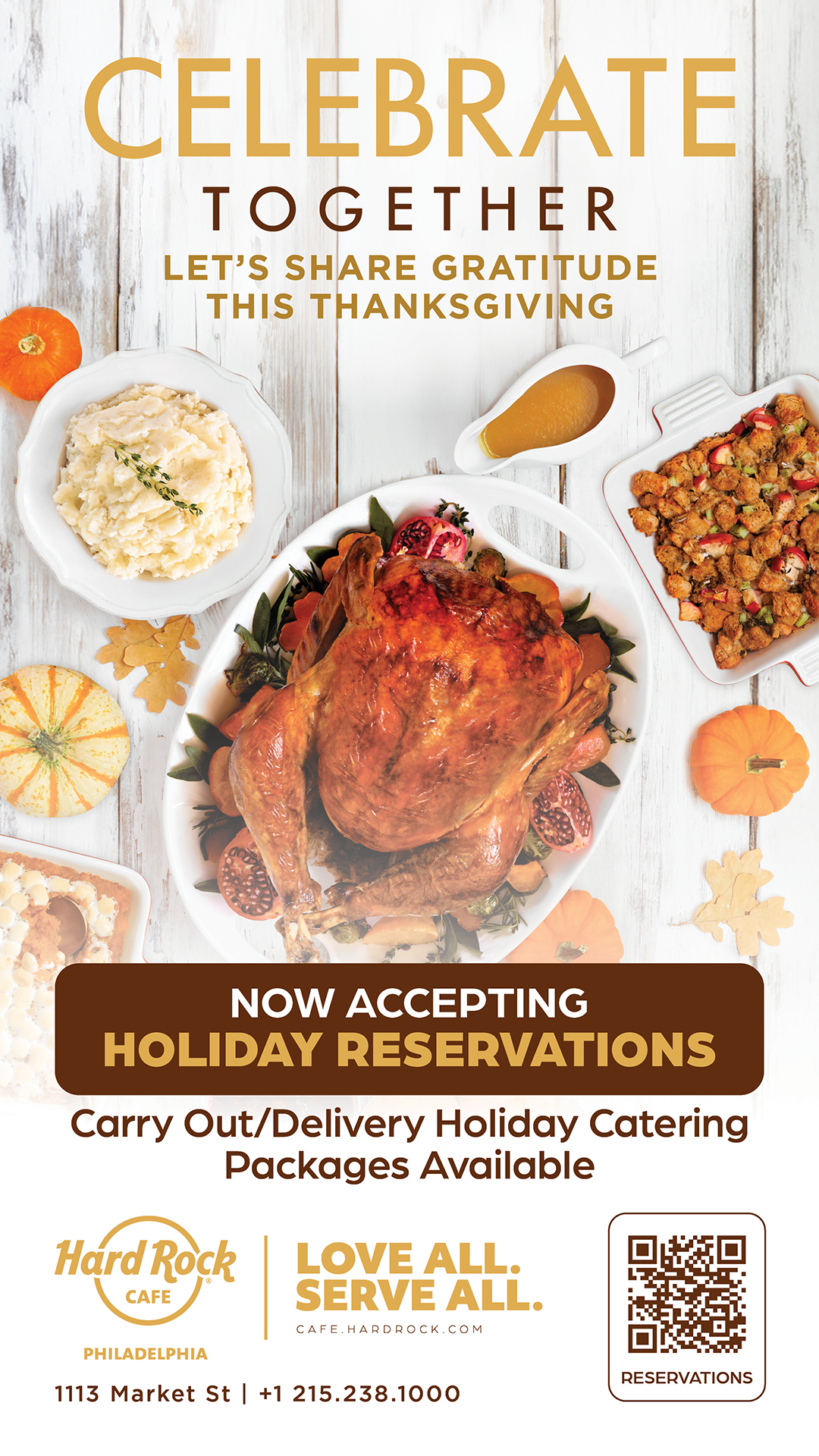 Picture of a table set for Thanksgiving with a turkey, mashed potatoes, stuffing, and gravy.