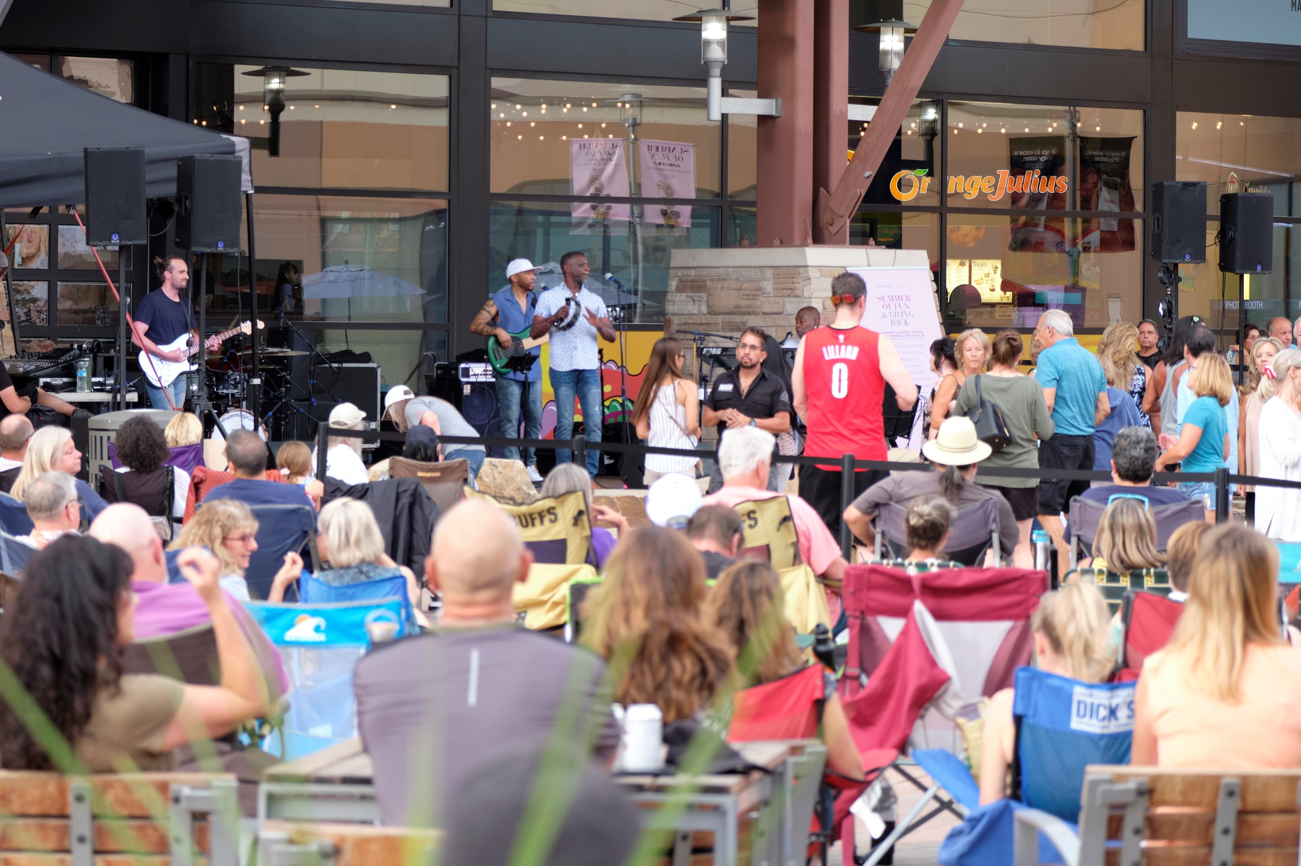 Concert crowd and band performing on stage