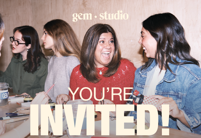 People gathered around a workshop table at Gem Studio, collaborating on a hands-on jewelry-making activity, with large text reading “YOU’RE INVITED!” overlaid on the image.