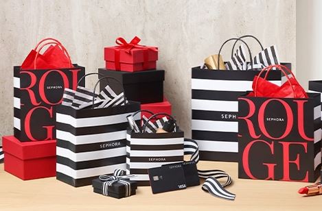 black, white and red shopping bags for Sephora on a table