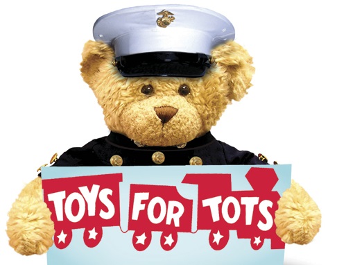 Teddy Bear in a Marines uniform holding a Toys For Tots sign