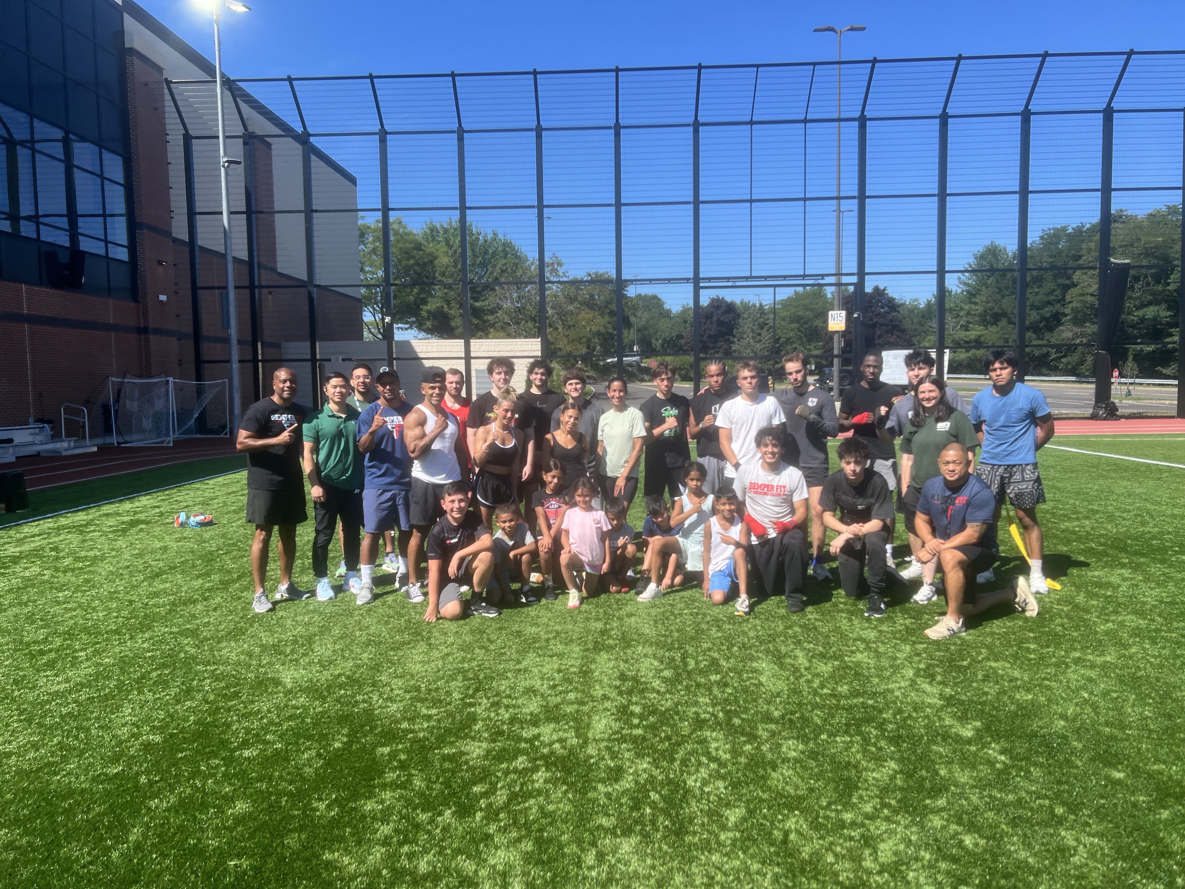 Group of people in athletic wear on Dick's House of Sport's Field
