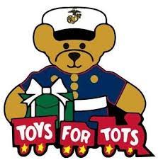 Color picture of Toys for Tots train with Marine holding the train.