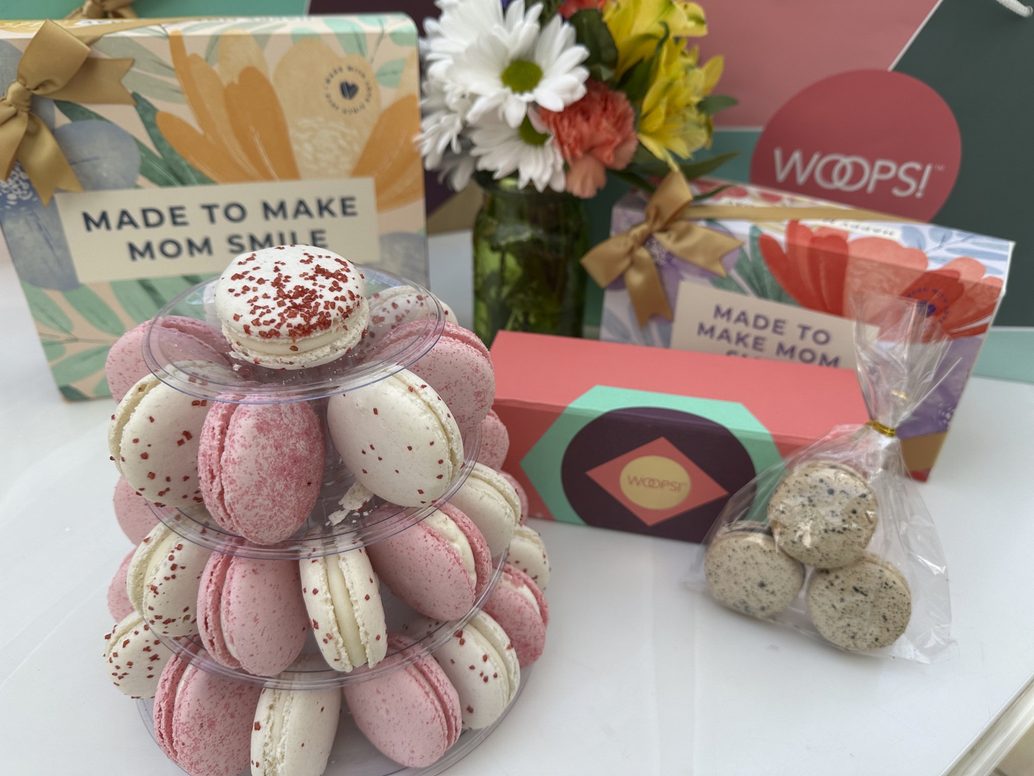display of pink and white macarons, and various gift boxes for Mother's Day