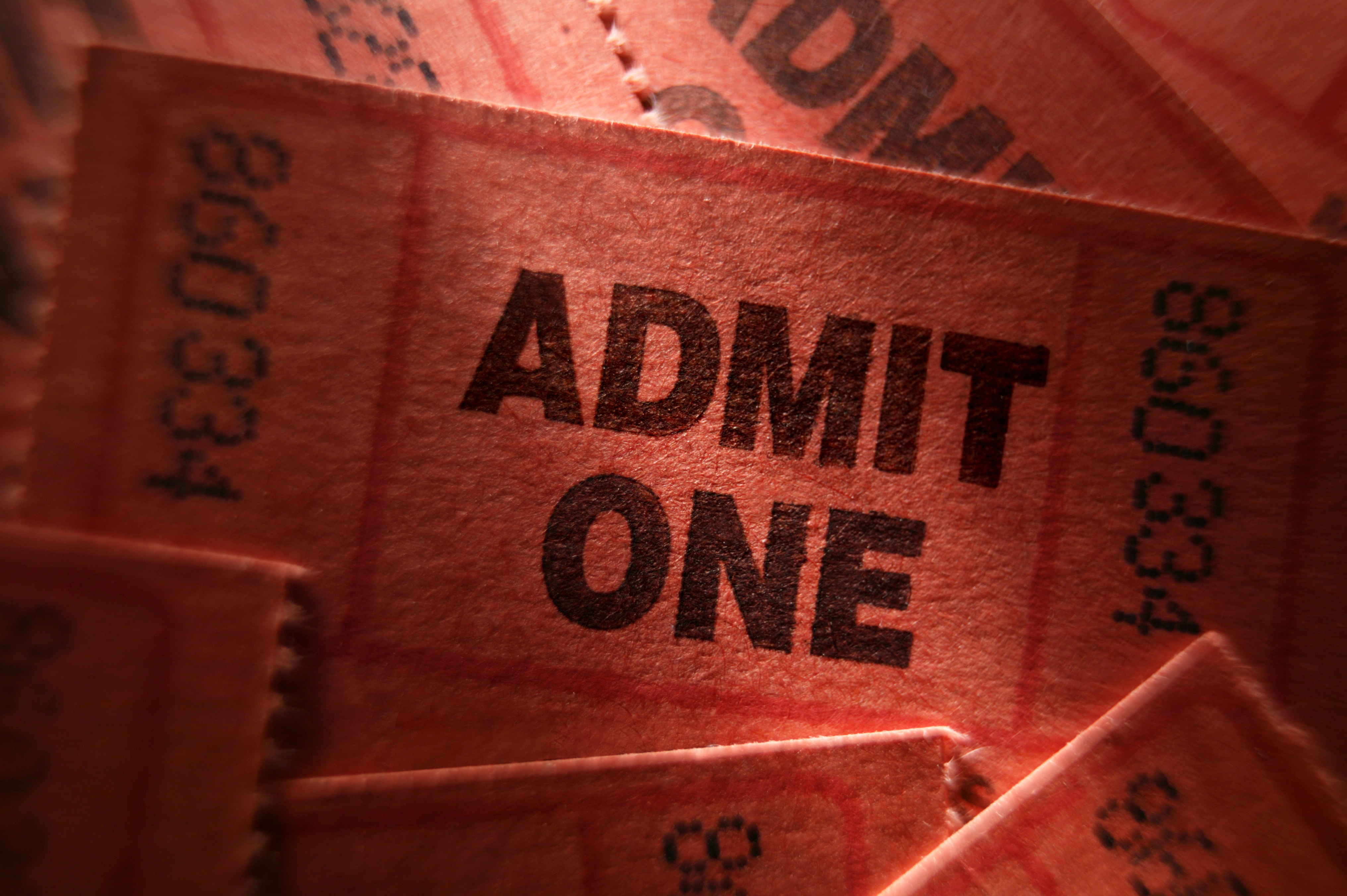Red numbered tickets with wording "Admit One"