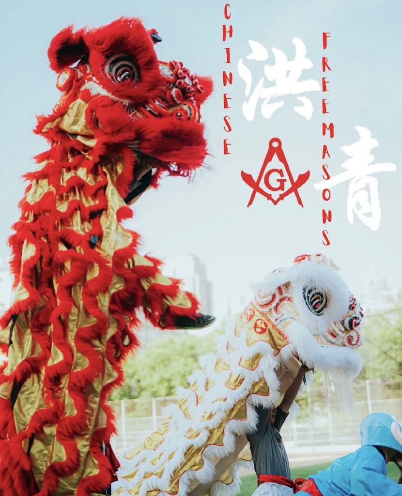 image of two lion dancers in red and gold and white and gold with outdoors 