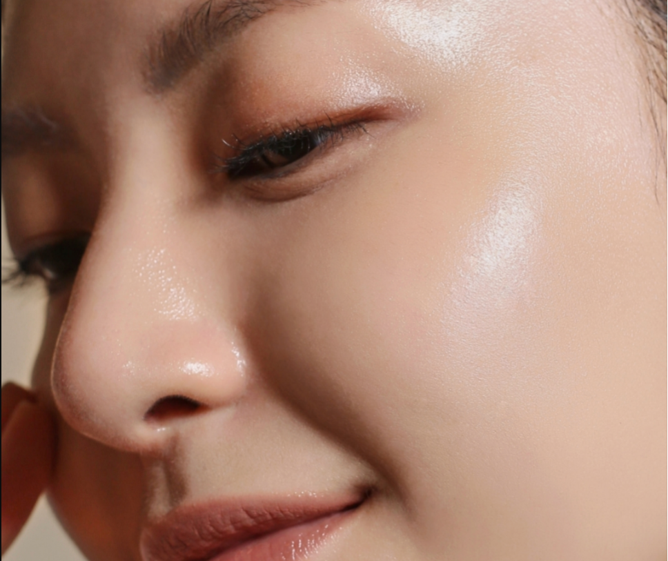 Close-up of glowing, smooth skin highlighting natural radiance and refined texture.