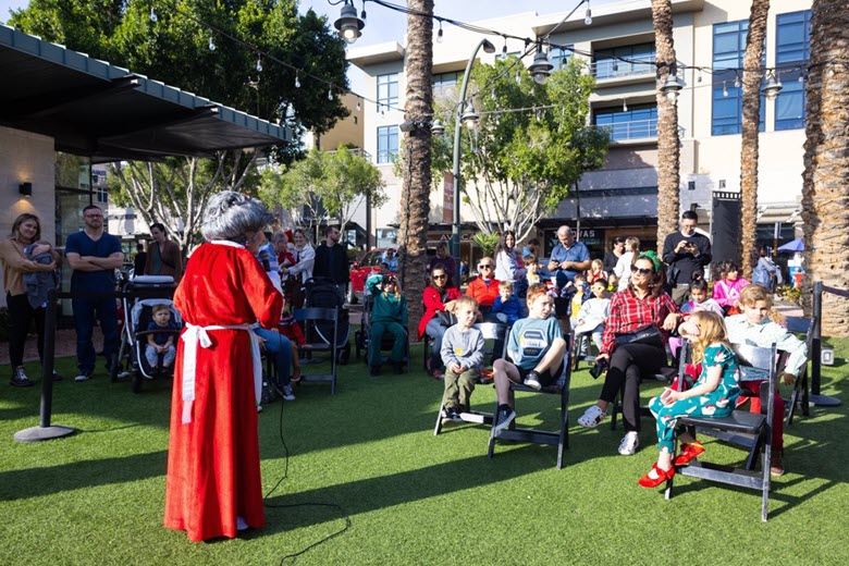 Mrs. Claus speaking to crowd.