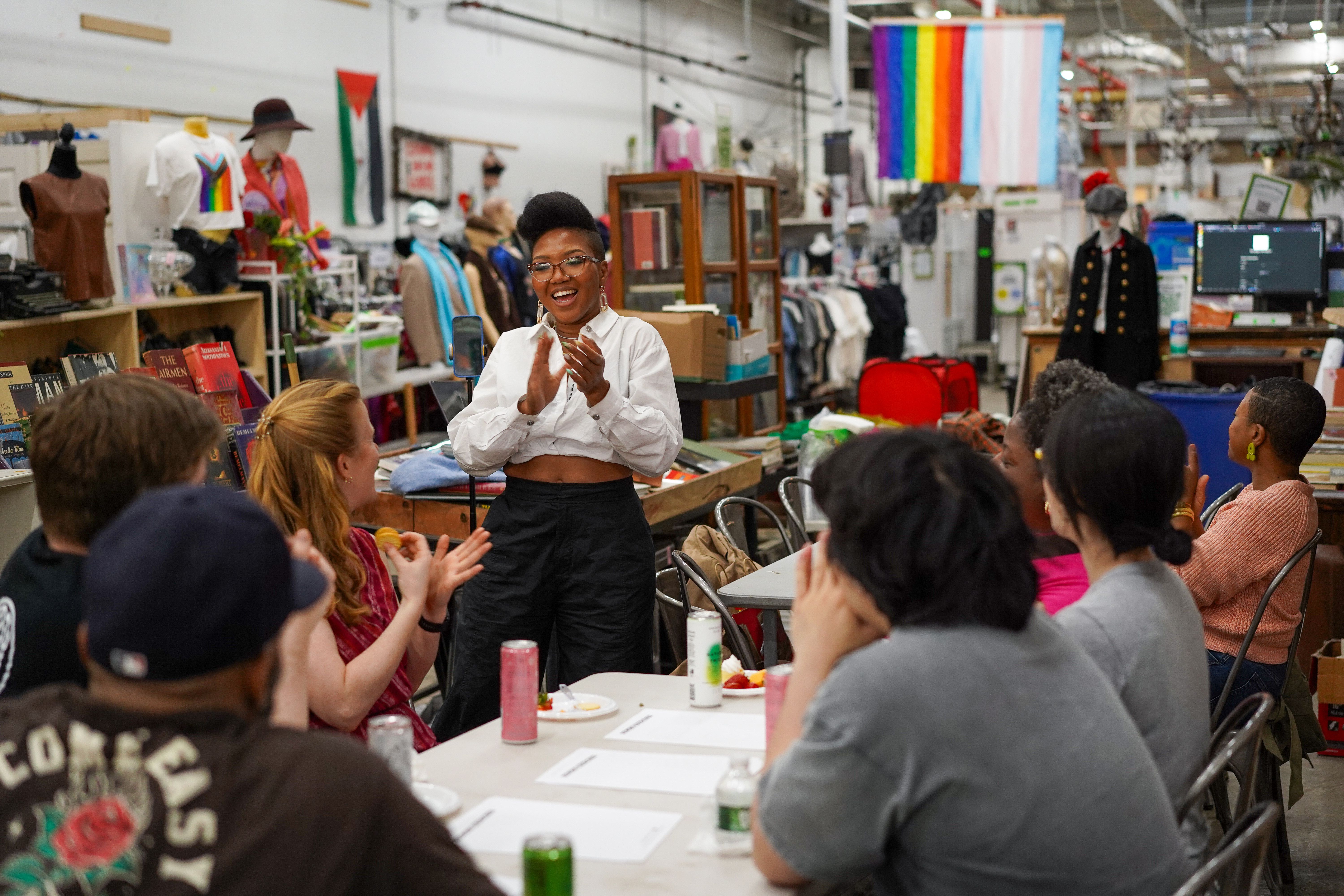 Professional seamstress talking to a class of adults