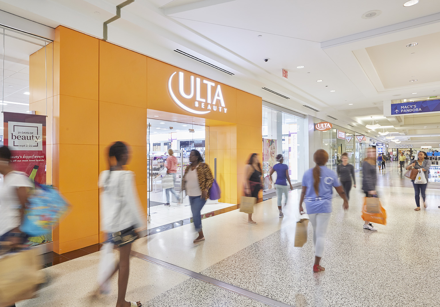 Storefront image of Ulta Beauty at Kings Plaza with shoppers walking by