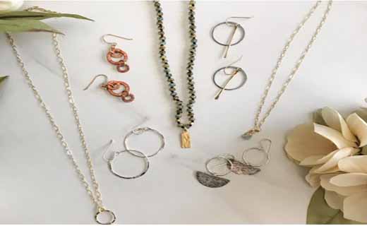 Flat lay of jewelry items including necklaces and earrings