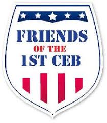 Badge Logo with blue/white stars across the top, Typed words Friends of the 1st CEB and Red/white bars across the bottom.