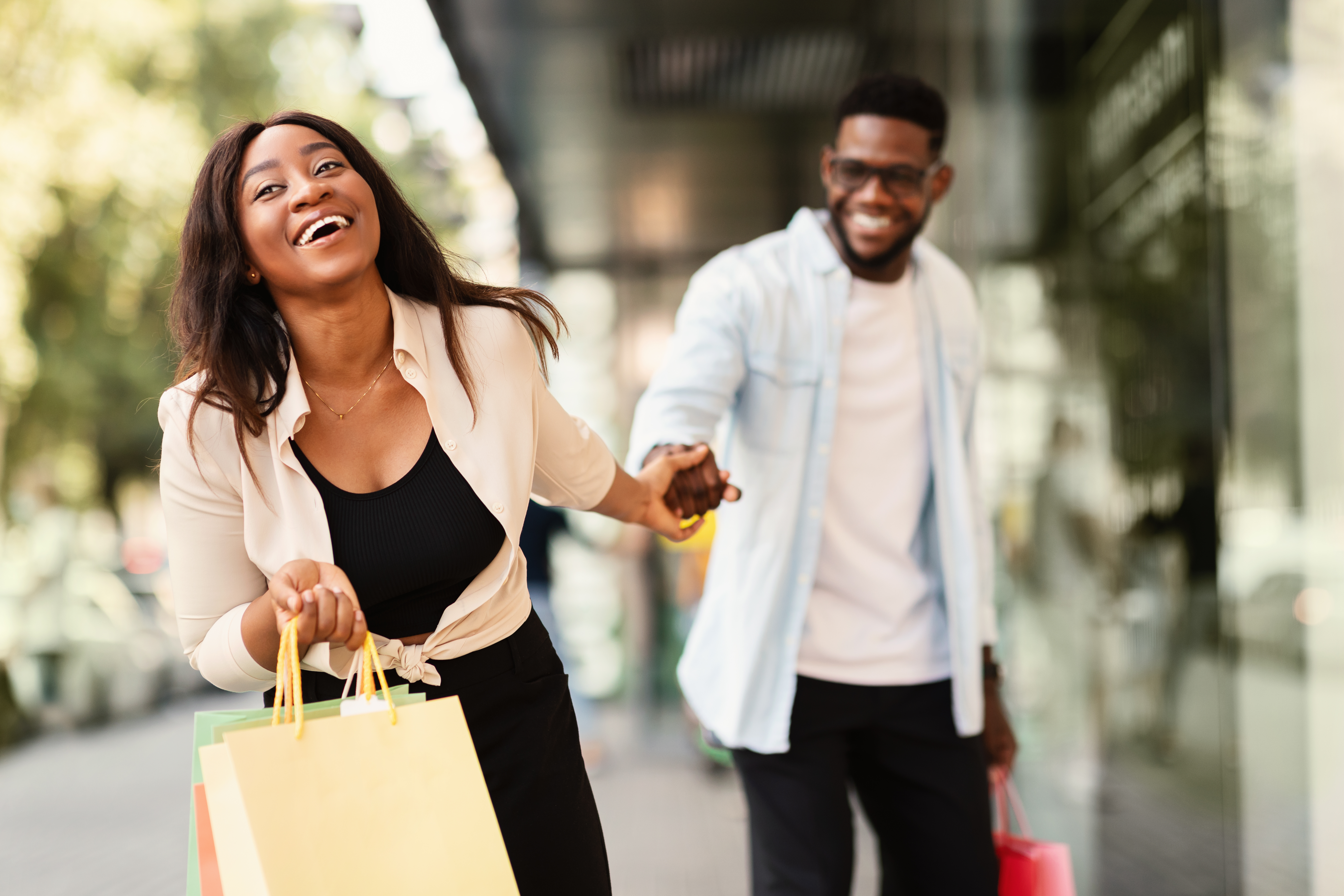 Woman and a man shopping, holding hands