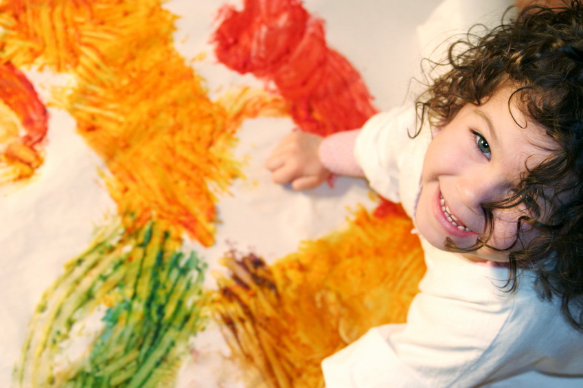 a girl finger painting
