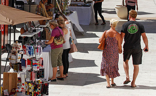 Couple walking through So Cal Etsy Guild vendors at The Oaks