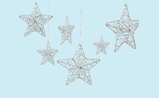 hanging star ornaments on blue background