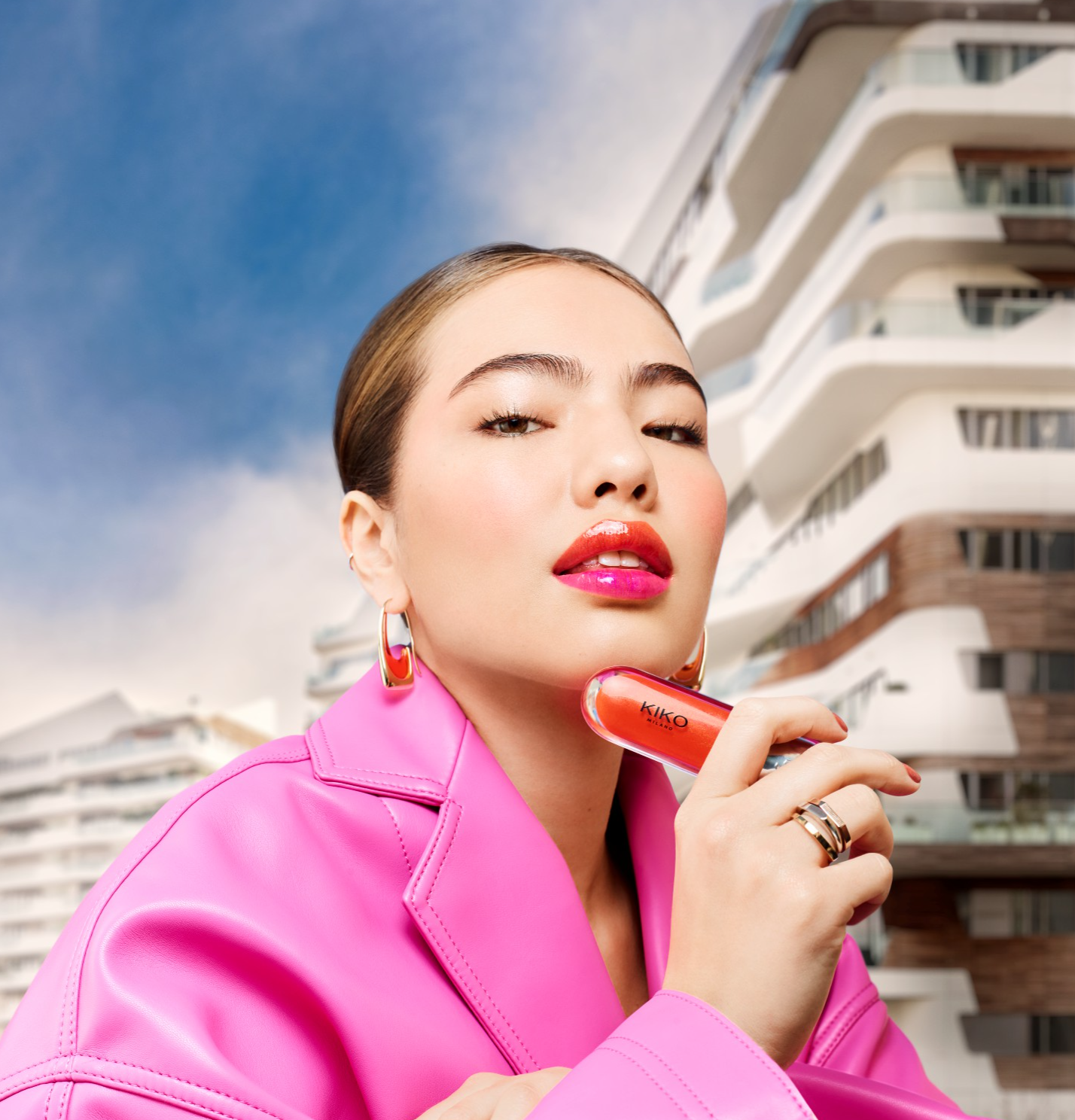 woman holding Kiko Milano lipstick