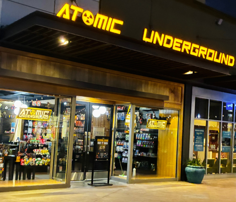 A storefront picture of Atomic Underground at night.