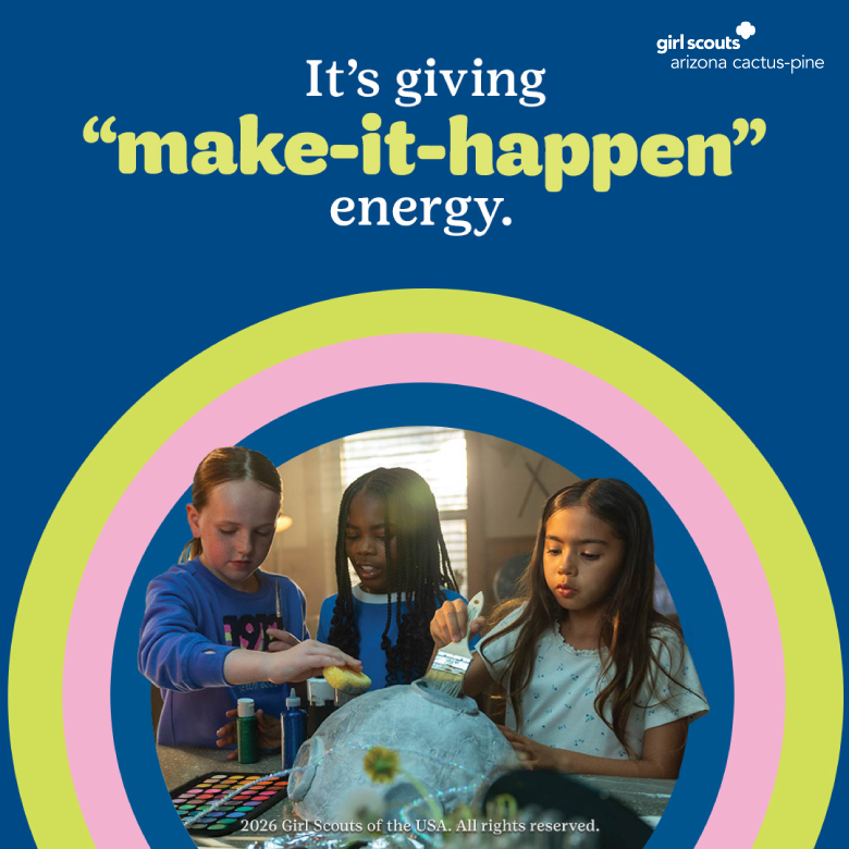 Girls doing a paper mache moon craft with paint supplies.