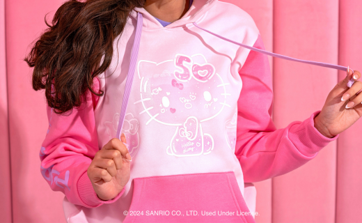 Woman wearing a pink Hello Kitty hoodie.