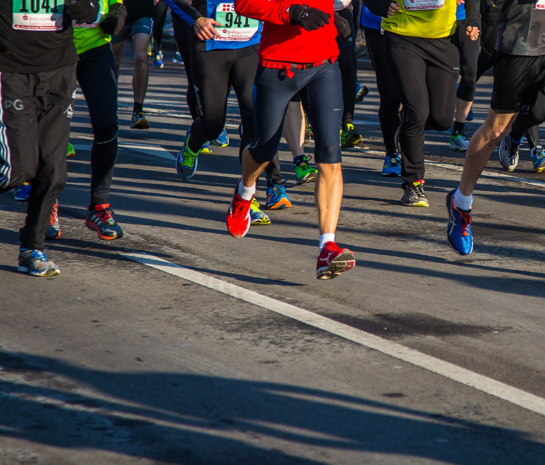 Marathon runners running on pavement.