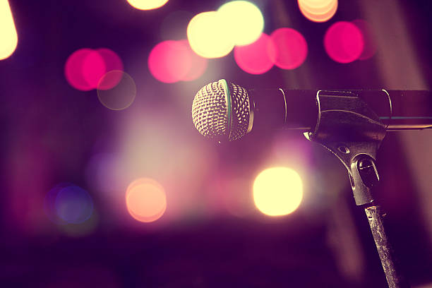microphone on stand on lit stage